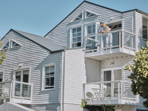 Homeowner enjoys energy savings with reflective roofing. A local roofer in San Jose can help you with cool roofing options.