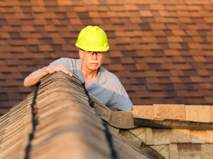 Professional San Jose roofer checking roof durability before the rainy season